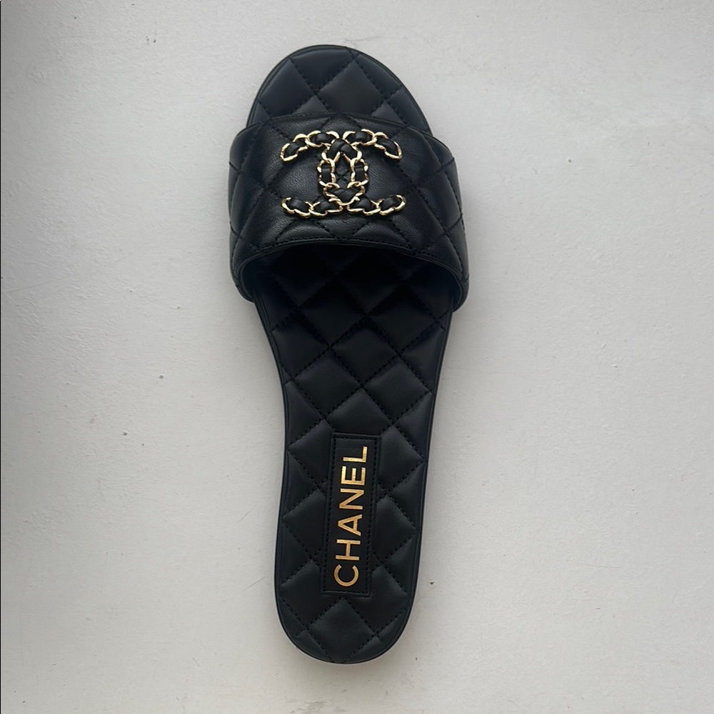 CHANEL Black and Gold Quilted Mules